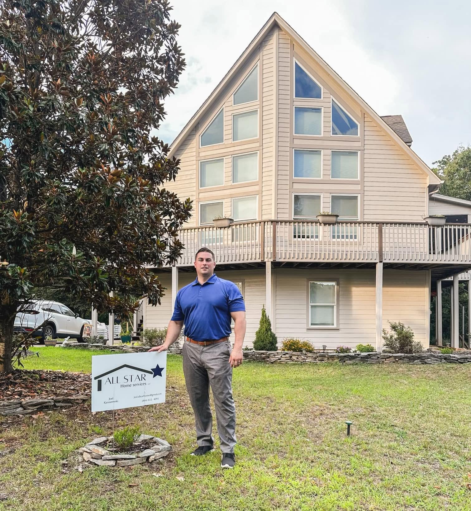 All Star Home Services representative standing in front of a completed home project
